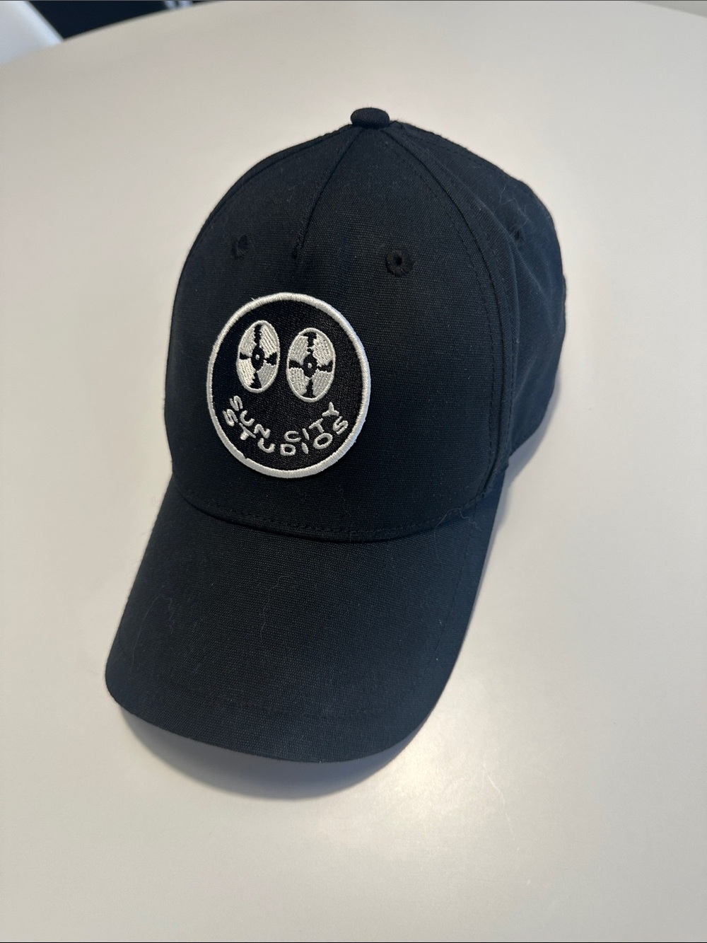 All Saints Black Cap with White Embroidered Logo